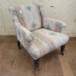 A late Victorian upholstered armchair, on turned front legs 80cm x 60cm, frame structurally sound