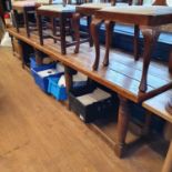 A pine refectory style table, on eight turned legs united by stretchers, top 300 x 70 cm