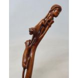 A 19th century folk art Wrythen walking stick, handle and shaft depicting a mahout being attacked by