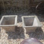 A pair of composite stone square garden planters, 40 cm high, and a pair of carved doors (4)