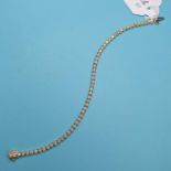 A 14ct gold and diamond bracelet, approx. 2.3ct