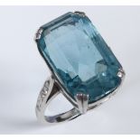 A platinum and aquamarine cocktail ring, with diamonds set to the shoulders, approx. ring size O½