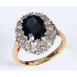 An 18ct gold, sapphire and diamond oval cluster ring, approx. ring size L