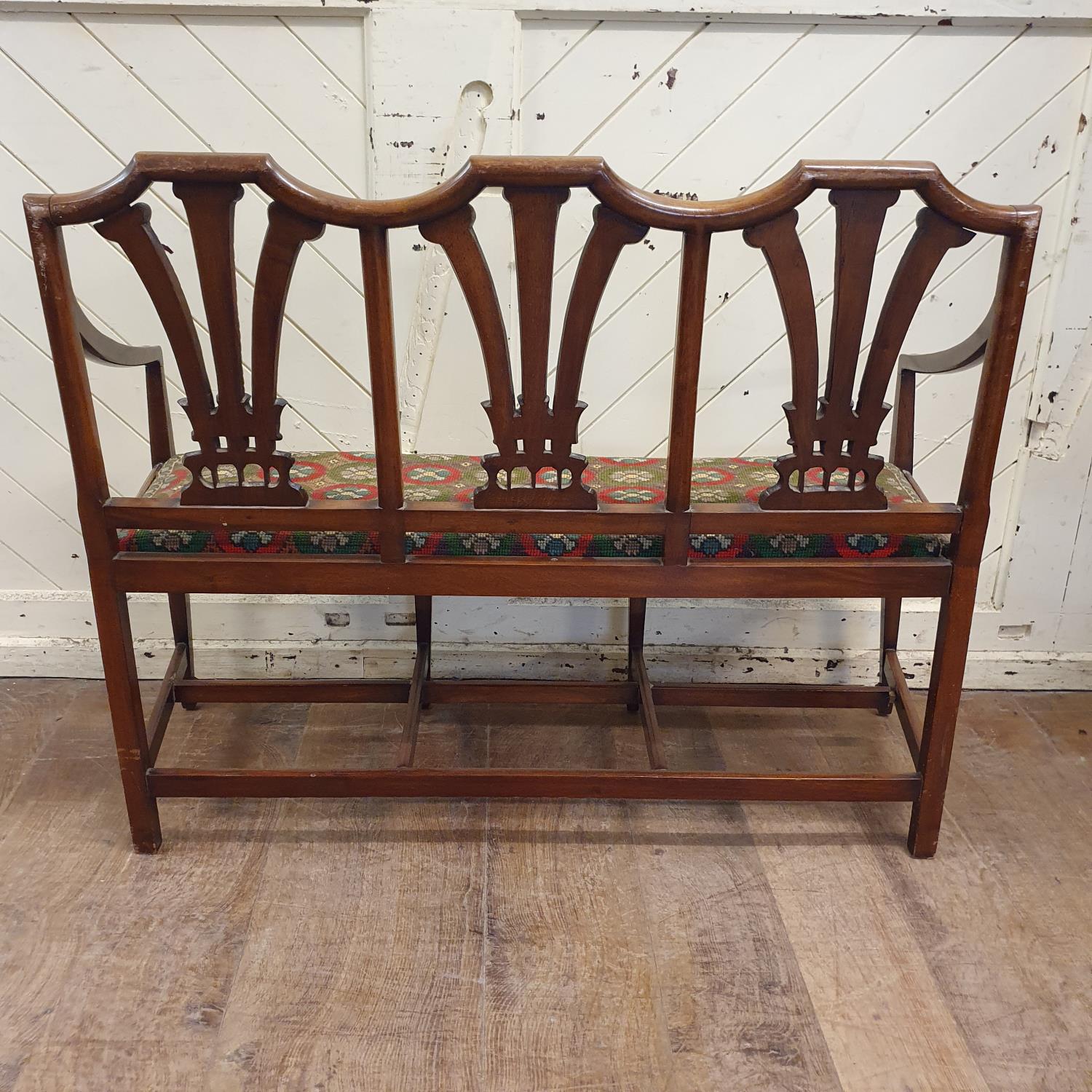 An unusual child's walnut chair back settee, with fleur de lys backs, a drop in seat and tapering - Image 3 of 3