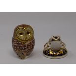 A Royal Crown Derby owl, 12 cm high, two other Royal Crown Derby weights, a Royal Doulton Oliver