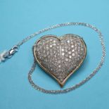 A gold heart shaped pendant, pave set diamonds, on a chain