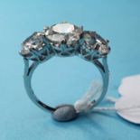 An 18ct white gold and three stone diamond ring, 3.84ct, approx. ring size K½ multiple visible