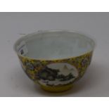 A Chinese porcelain medallion bowl, decorated vignettes of mountain scenes on a yelllow ground