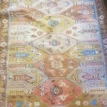 Cream ground rug, main floral border, centre with repeating lozenge shaped medallions, 173 x 104 mm