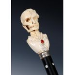 A 19th century memento Mori walking cane, with ivory and jewelled handle, with white metal collar,