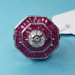 A platinum octagonal diamond and ruby ring, set with a central RBC diamond (1.00ct, approx) and