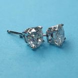A pair of white gold and diamond stud earrings, 1.95ct