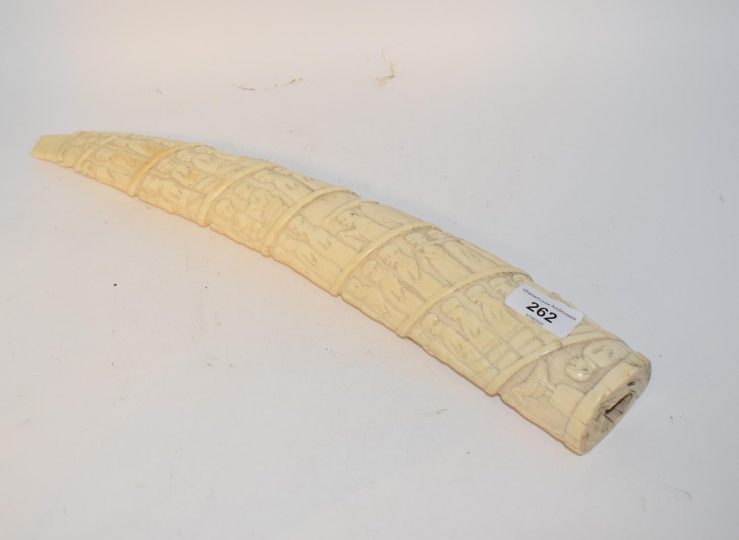 A late19th/early 20th century Congolese ivory tusk, carved figures in a procession, 44 cm cracks