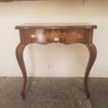 A 19th century walnut serpentine side table, with marquetry inlaid frieze, on cabriole legs, 74 cm