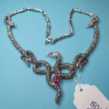 A silver, marcasite and ruby set snake necklace