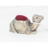 A silver plated camel pin cushion