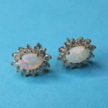 A pair of 18ct gold, opal and diamond earrings, approx. 1ct