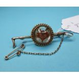 A hunting brooch, in the form of a riding crop mounted with an Essex crystal fox mask, 5.5 cm wide