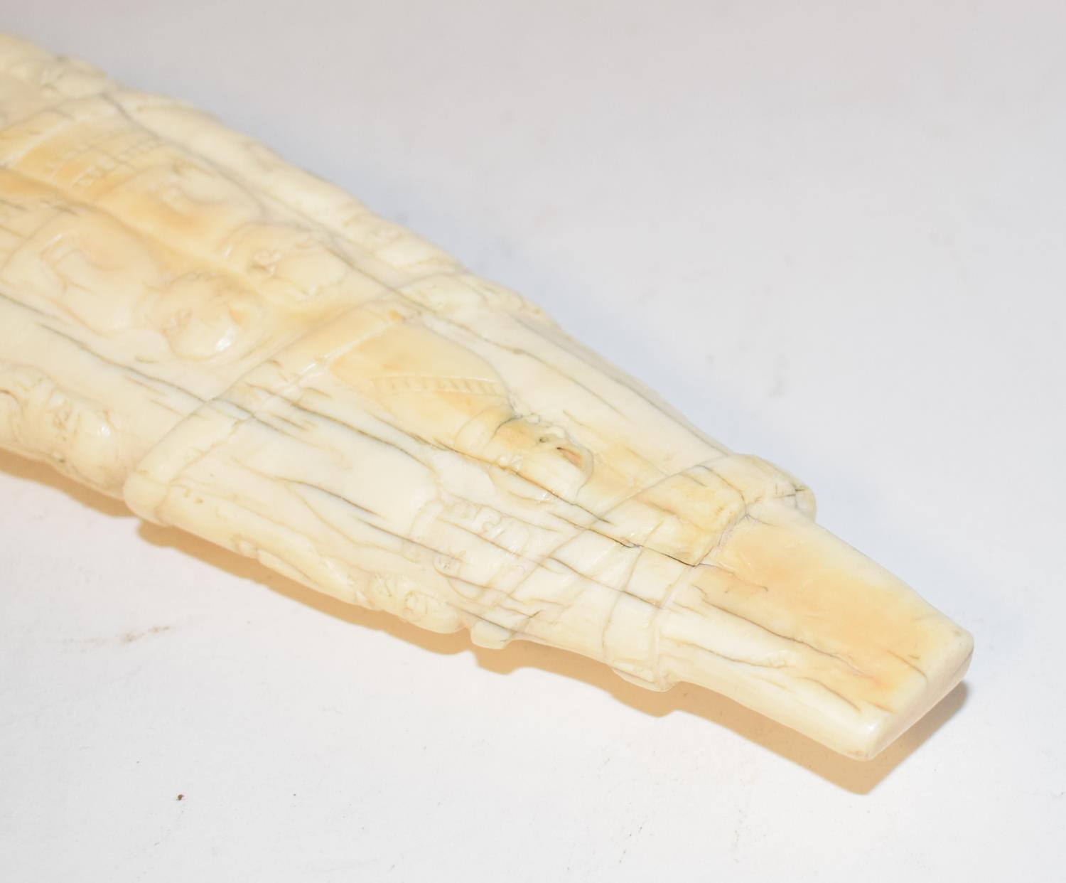 A late19th/early 20th century Congolese ivory tusk, carved figures in a procession, 44 cm cracks - Image 4 of 4