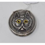 A novelty silver cat face vesta case