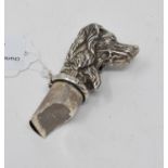 A novelty silver dog whistle and vesta case
