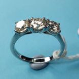 An 18ct white gold three stone diamond ring, diamonds 1.60ct