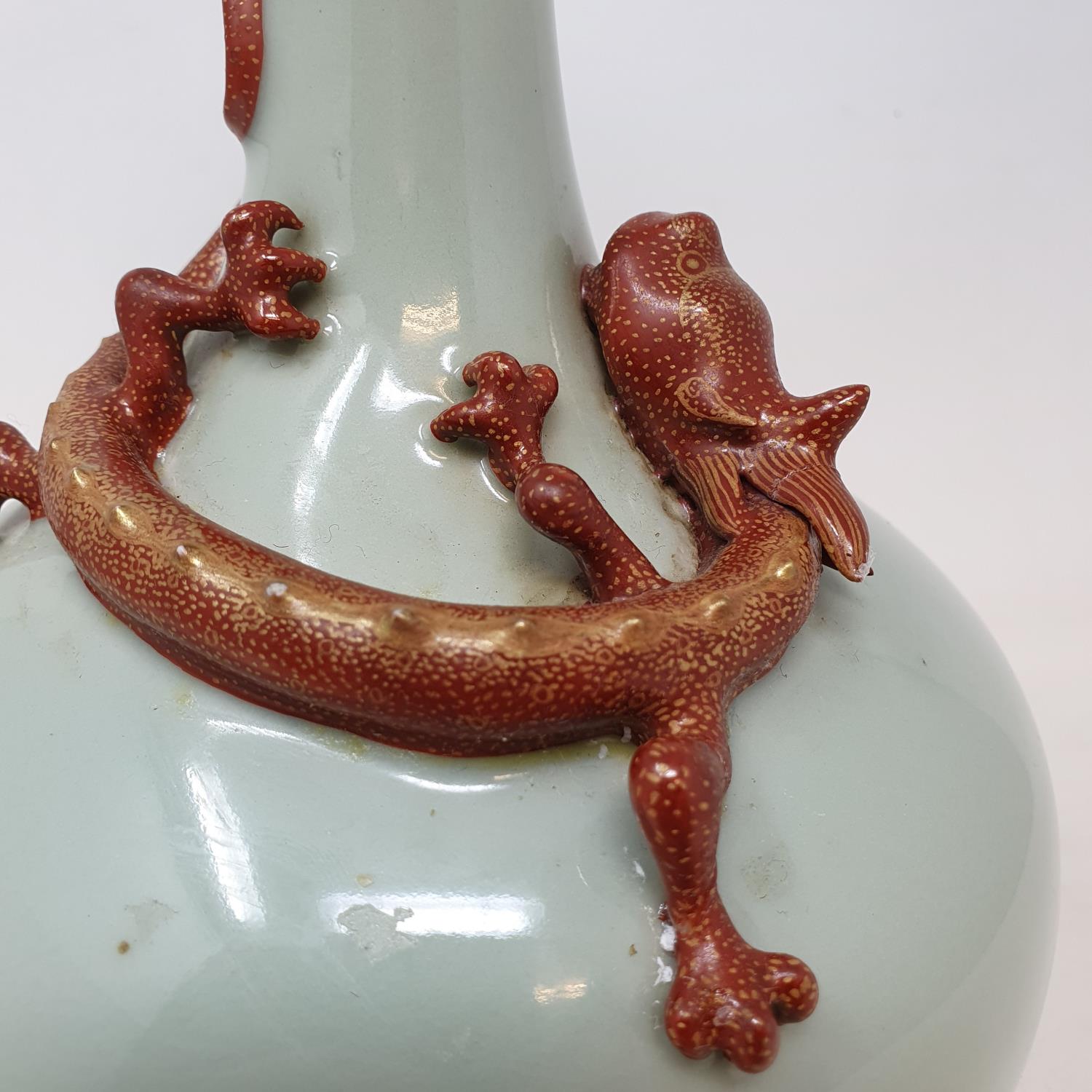 A Chinese celadon ground bottle vase, with a slender neck, applied a Chilong dragon with gilt - Image 4 of 7