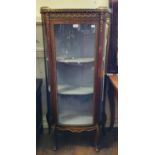 A late 19th century/early 20th century French vitrine, with gilt metal mounts, on cabriole legs,