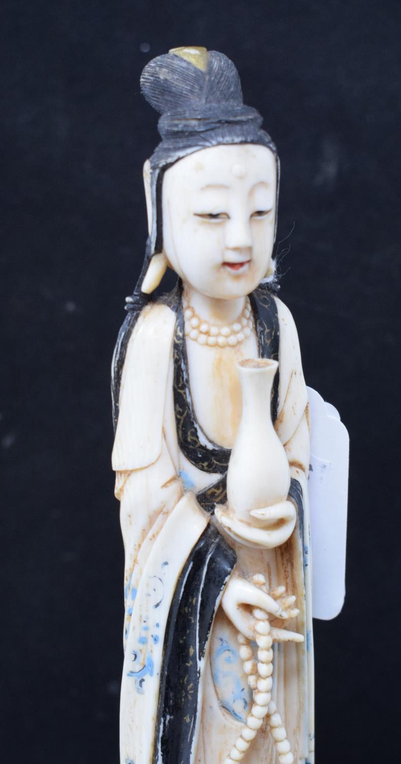 An early 20th century Chinese carved, stained and painted ivory figure, of a lady holding beads - Image 5 of 6