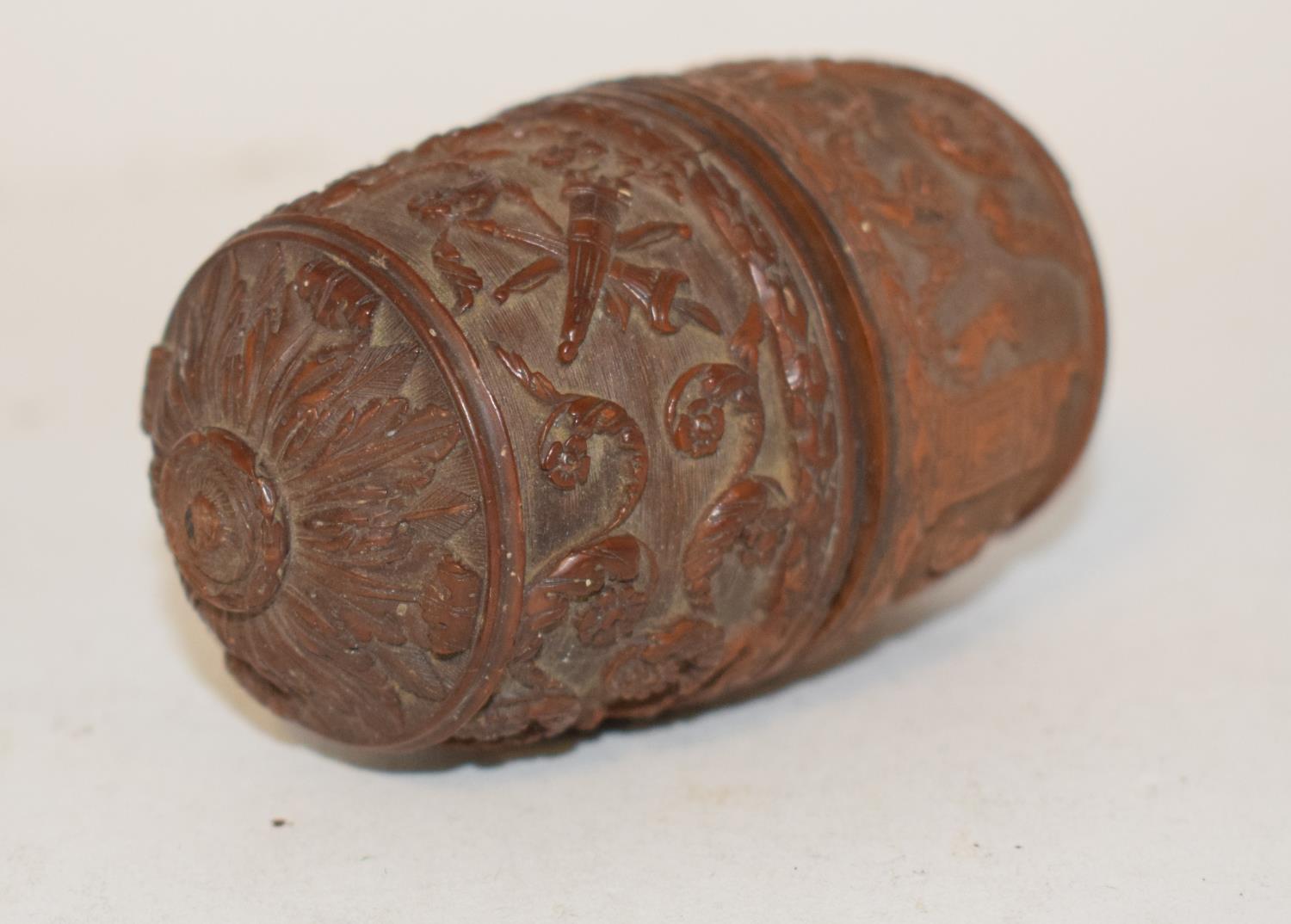 A late 18th/early 19th century nut, in two parts with a screw section, initialled, carved figures