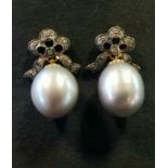 A pair of large grey cultured pearl and diamond bow top earrings, boxed