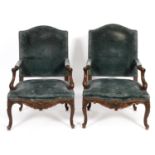 A pair of French upholstered armchairs, with rococo style carved decoration (2)