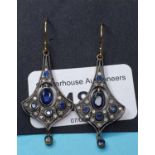 A pair of flared sapphire and diamond earrings, boxed