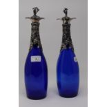 A pair of blue glass decanters, with plated mounts and stoppers, 33.5 cm high (2) Report by RB