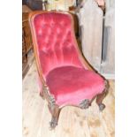 A 19th century mahogany button back nursing chair