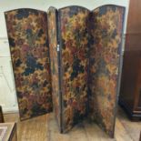 A four fold screen, painted flowers and foliage, 223 cm wide all sides with some areas of damage