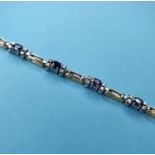 A 14ct gold, sapphire and diamond panel bracelet