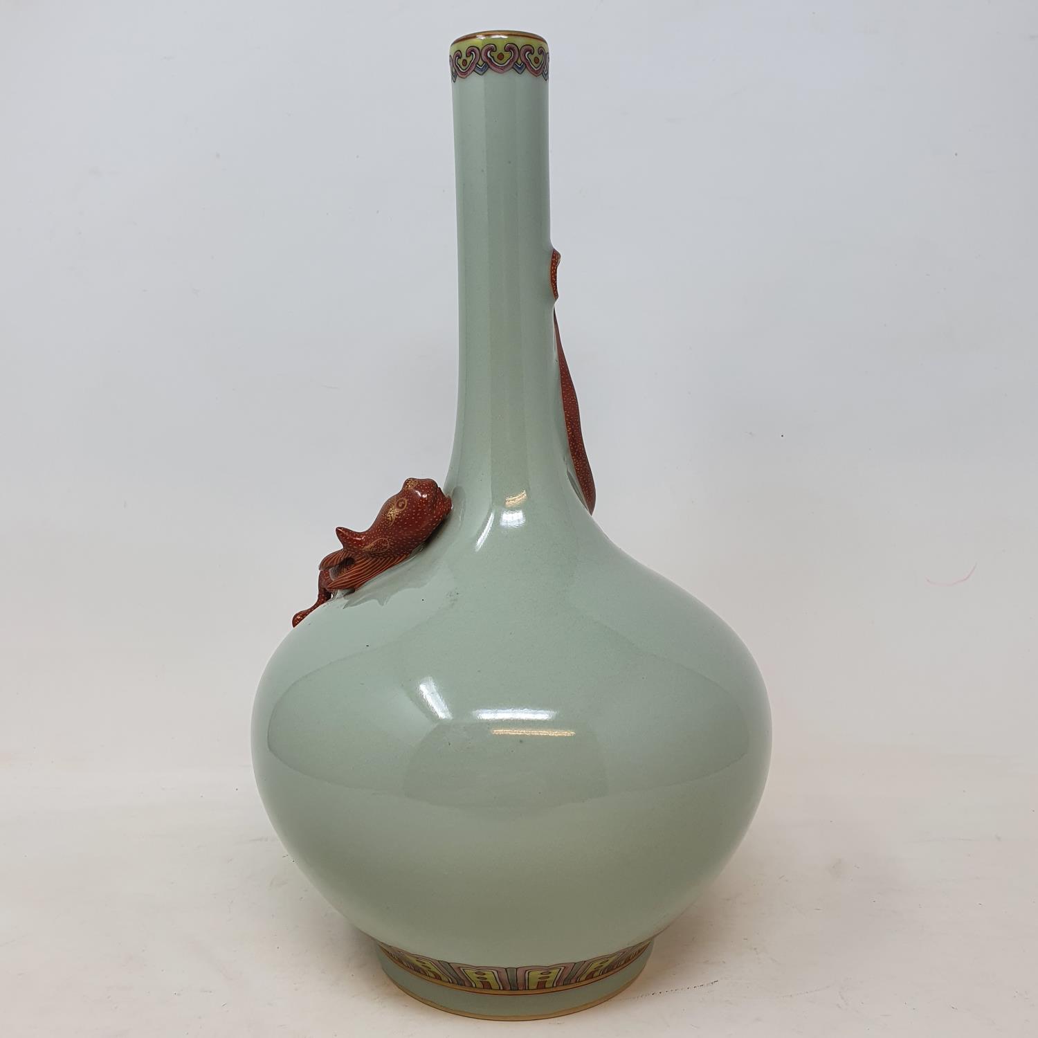 A Chinese celadon ground bottle vase, with a slender neck, applied a Chilong dragon with gilt - Image 3 of 7