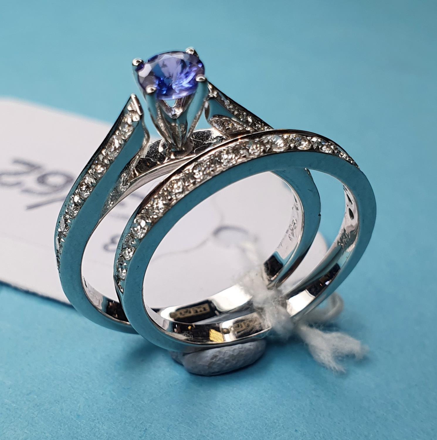 An 18ct white gold, diamond and tanzanite ring, and a matching eternity ring, both approx. ring size