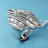 An Art Deco style 18ct white gold channel set baguette cut diamond ring, diamonds 1.65 ct