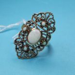 A 9ct gold and opal set filigree ring
