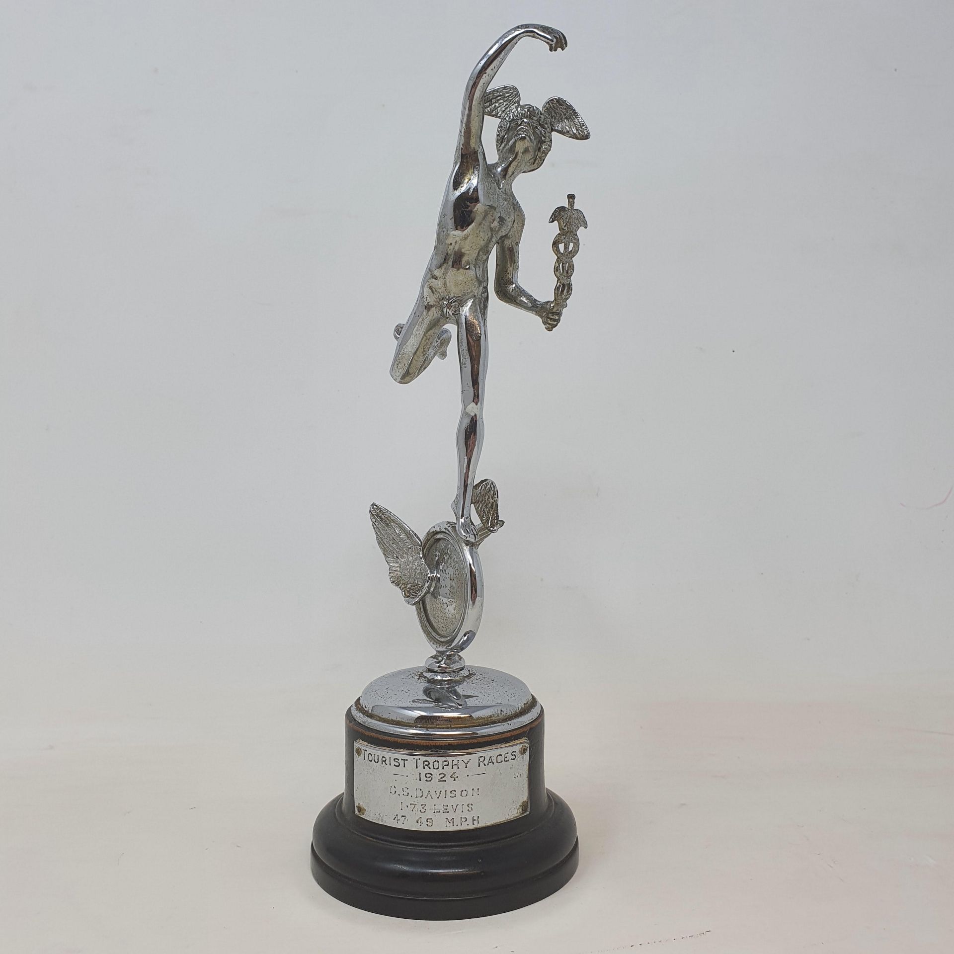 An Isle of Man TT silver replica trophy, 1924 award, mounted on a wooden plinth with applied