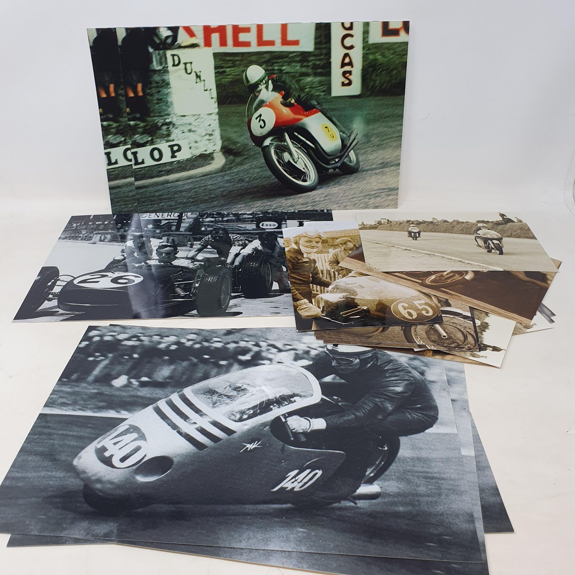 An assortment of black and white and colour photographs of John Surtees competing on both two and