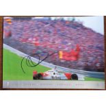 A colour poster of a Mercedes Benz GP car racing at Imola driven by David Coulthard, signed, and