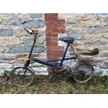 A Moulton bicycle, an Enfield Musketeer bicycle, and two other bicycles, all barn stored