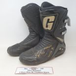 A pair of Gaerne black motorcycle boots worn by Chris McGahan, 4 x Manx winner, both boots signed (