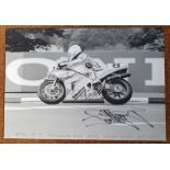 A period black and white photograph of Carl Fogarty competing at the 1991 TT Formula One race on the