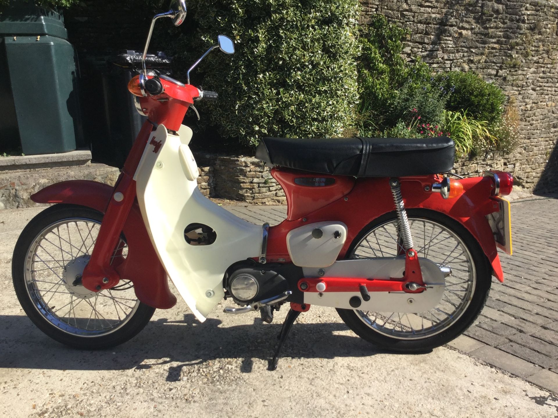 A 1974 Honda C50 Registration number UOT 61M V5C, red Totally restored about five years ago Many new