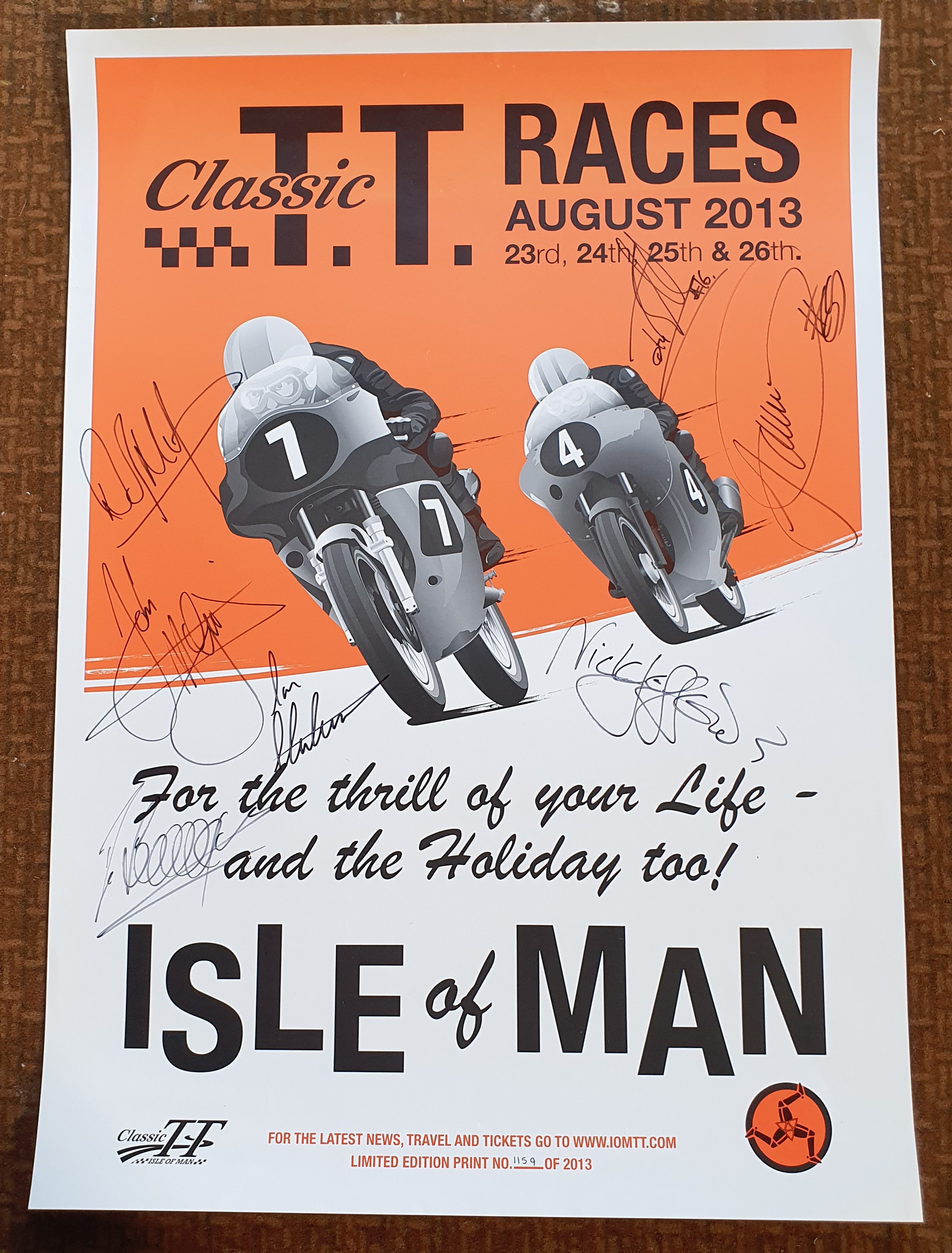 An August 2013 Classic TT Races promotional poster, with multiple participating signatures,