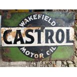 A Castrol Wakefield Motor Oil sign, repainted, 76 cm wide, a Shell plastic sign, cracked, 110 cm